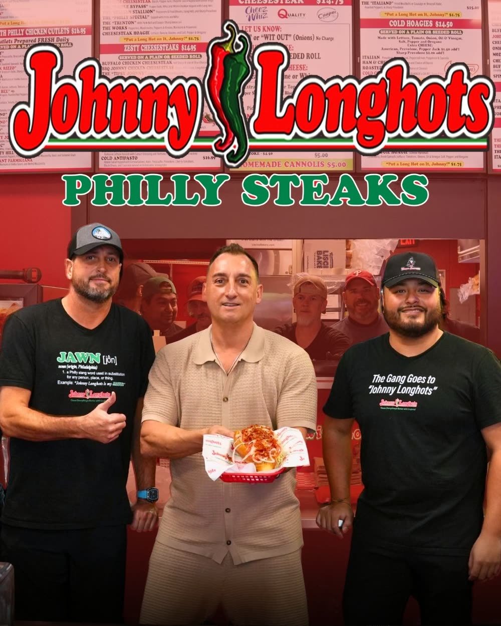 The team at Johnny Longhots Philly Steaks in Sarasota holding a cheesesteak under the shop logo