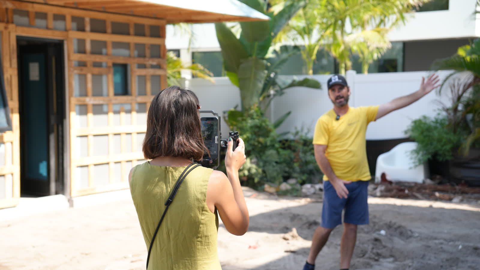 Anastasia Butvina of Siesta Media filming a client on a Sarasota job site