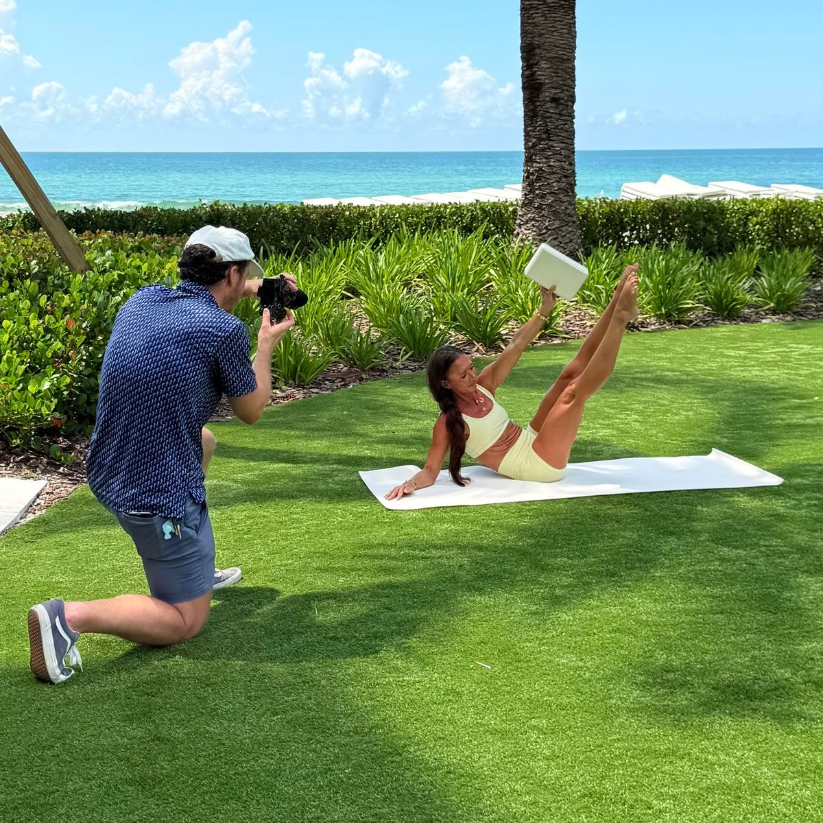 Siesta Media filming a yoga instructor on the lawn at a Sarasota resort
