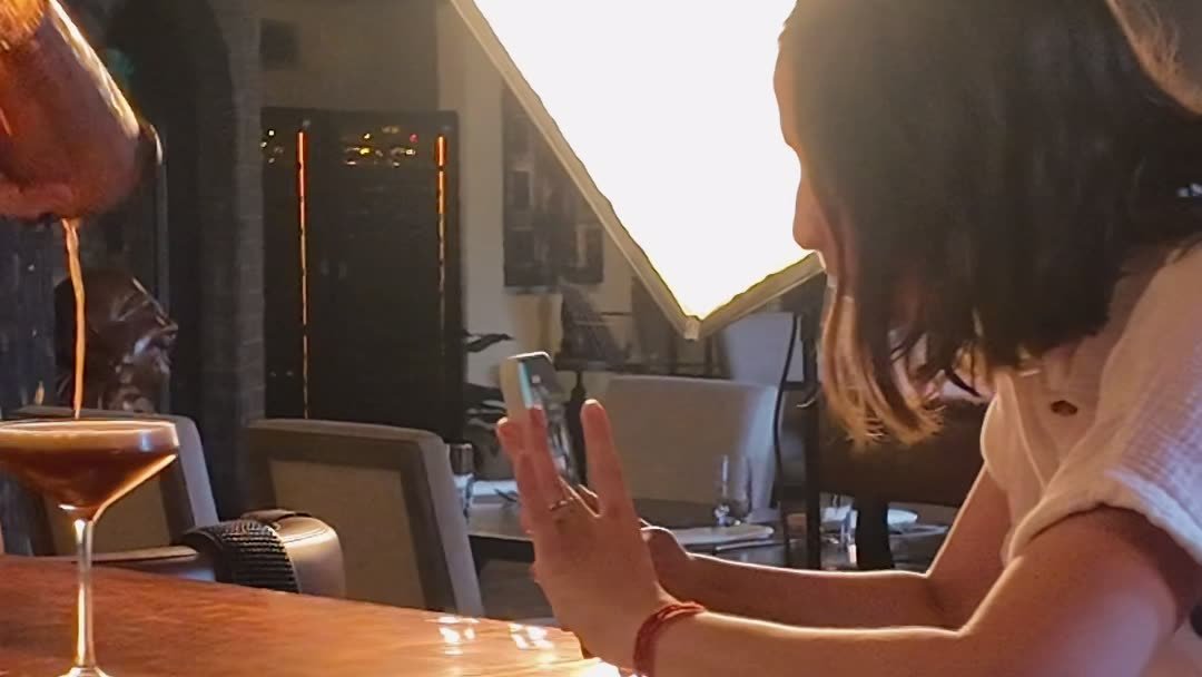 Siesta Media filming a cocktail pour at the bar at Sage SRQ on a shoot day