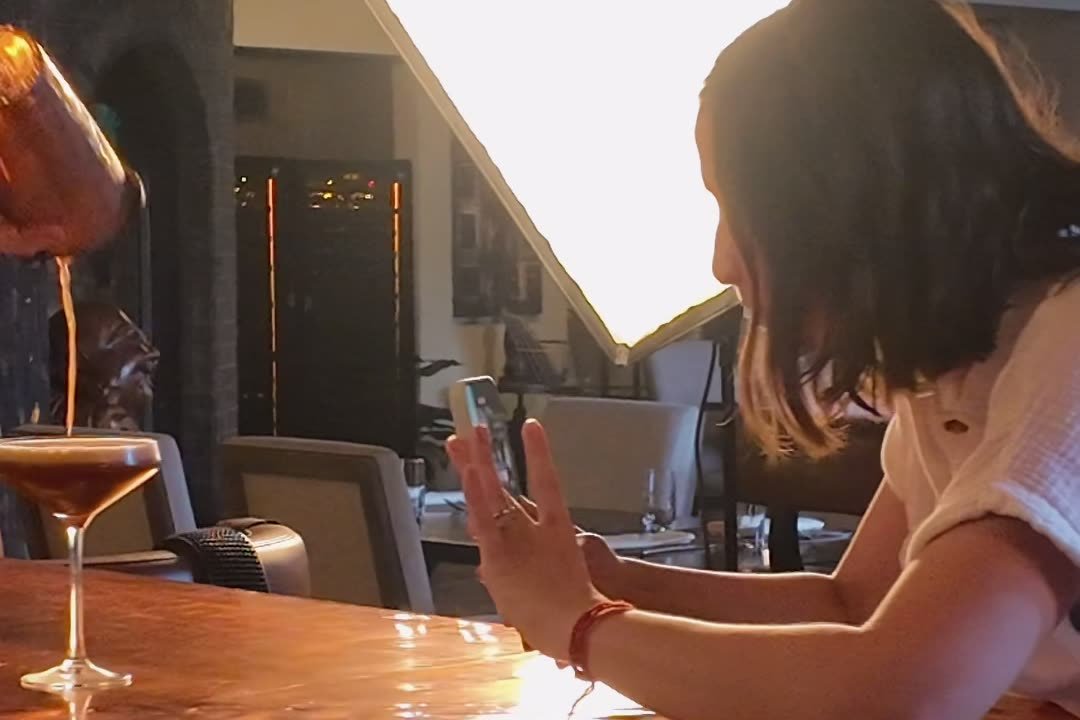 A social media management shoot day at Sage SRQ in Sarasota: filming a cocktail pour at the bar